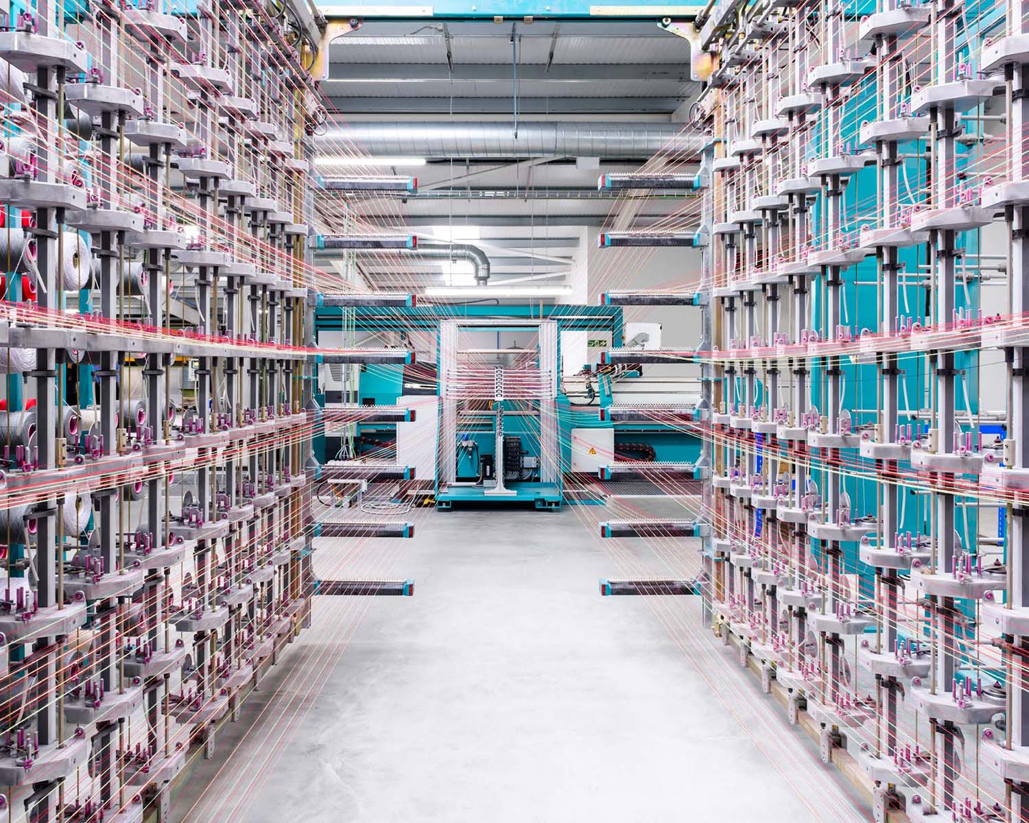 Creel full of yarn making a warp at Wooltex textile mill; Kvadrat, United Kingdom