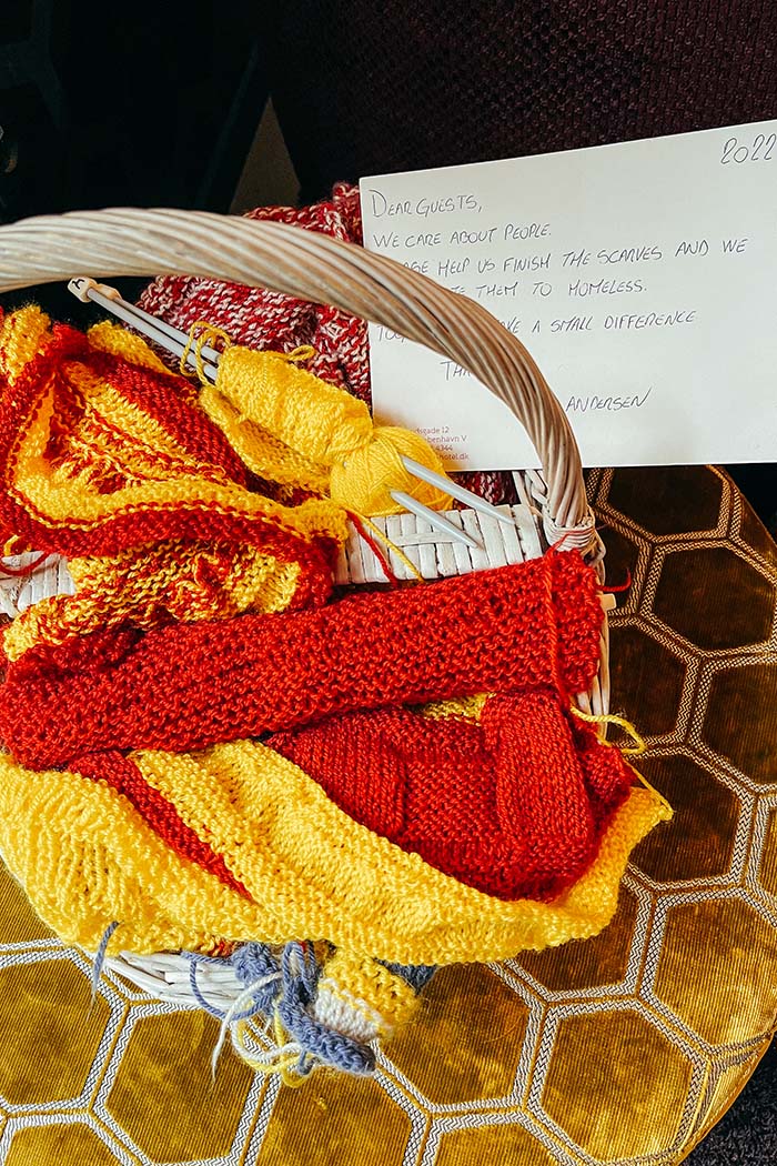 An insight into the Andersen's community approach, guests can help finish knitting scarves to be donated to the city's homeless