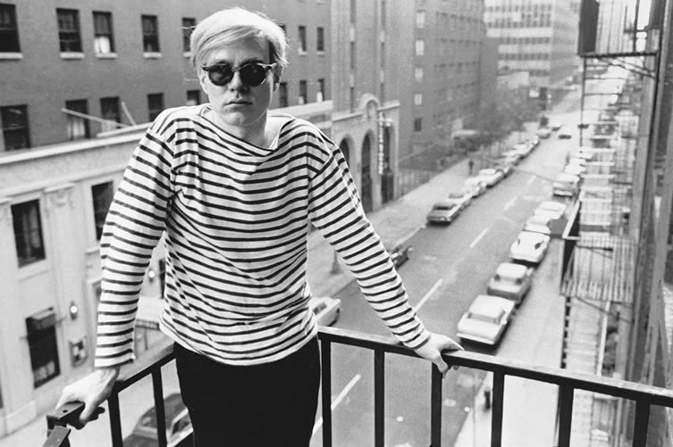 Andy Warhol on fire escape of the Factory