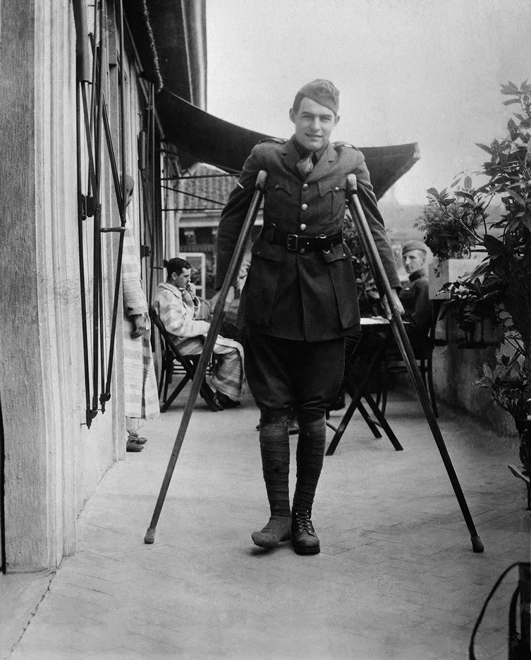 Ernest Hemingway on crutches while recovering in Milan