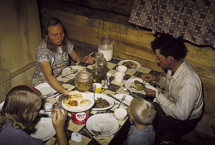 The Faro Caudill Family Eating Dinner in Their Dugout, Pie Town, New Mexico, 1940