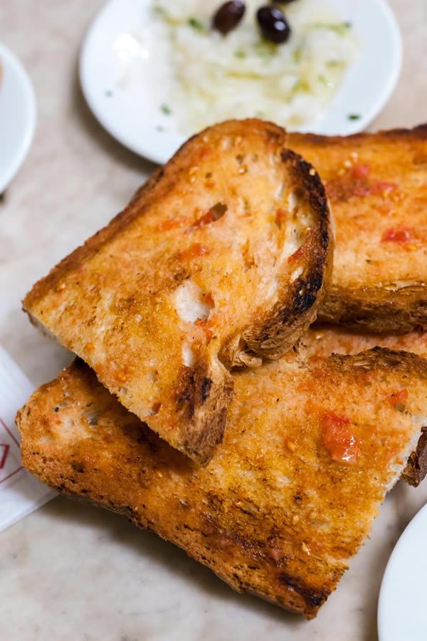 Pa amb tomàquet: bread rubbed with tomato, is a staple of Catalan cuisine; a dish that locals can’t live without