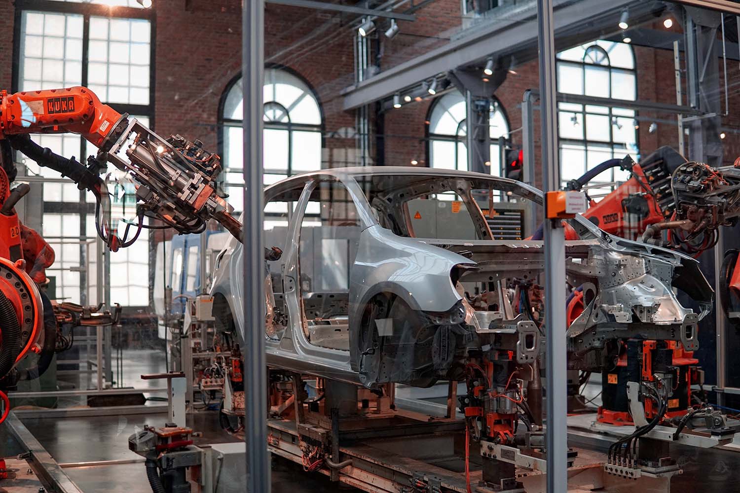 A worker assembles a sports car at the new factory of German car company  Wiesmann in Duelmen, Germany, Wednesday, April 2, 2008. Wiesmann creates  and handcrafts exclusive sport cars in a retro