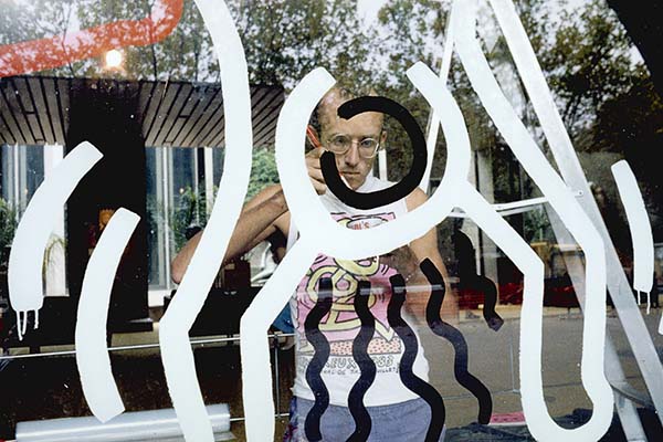 Keith Haring preparing an artwork on the Waterwall at the NGV, 1984