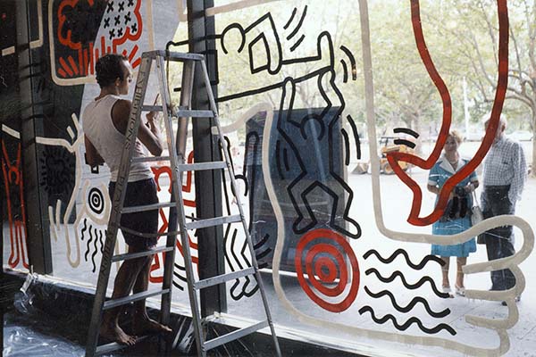 Keith Haring preparing an artwork on the Waterwall at the NGV, 1984