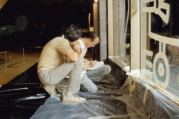 Keith Haring preparing an artwork on the Waterwall at the NGV, 1984