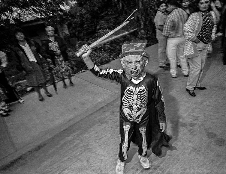 Boy in Skeleton Costume Waving Stick, Etla, 2001