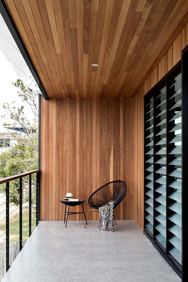 Using contemporary materials, such as rich wooden panelling or bold concrete tiles, can transform a simple balcony into a city centre paradise