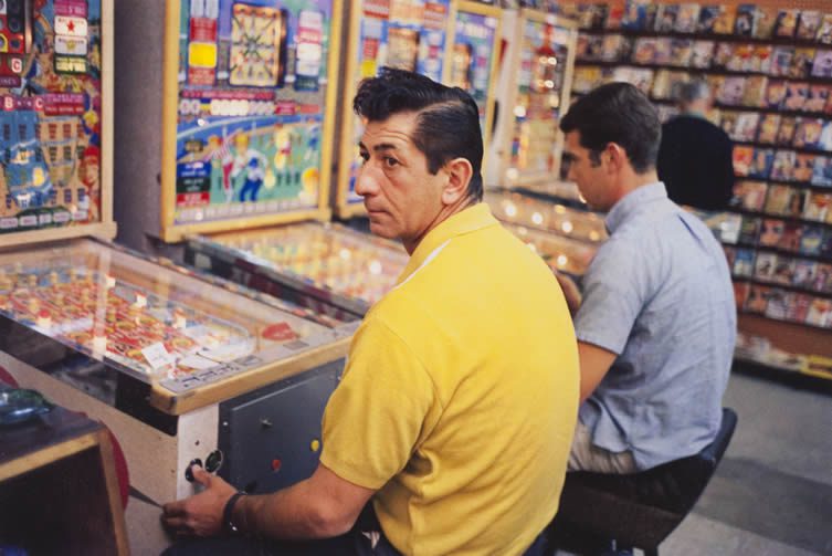 William Eggleston, Las Vegas, (yellow shirt guy at pinball
machine), 1965-68