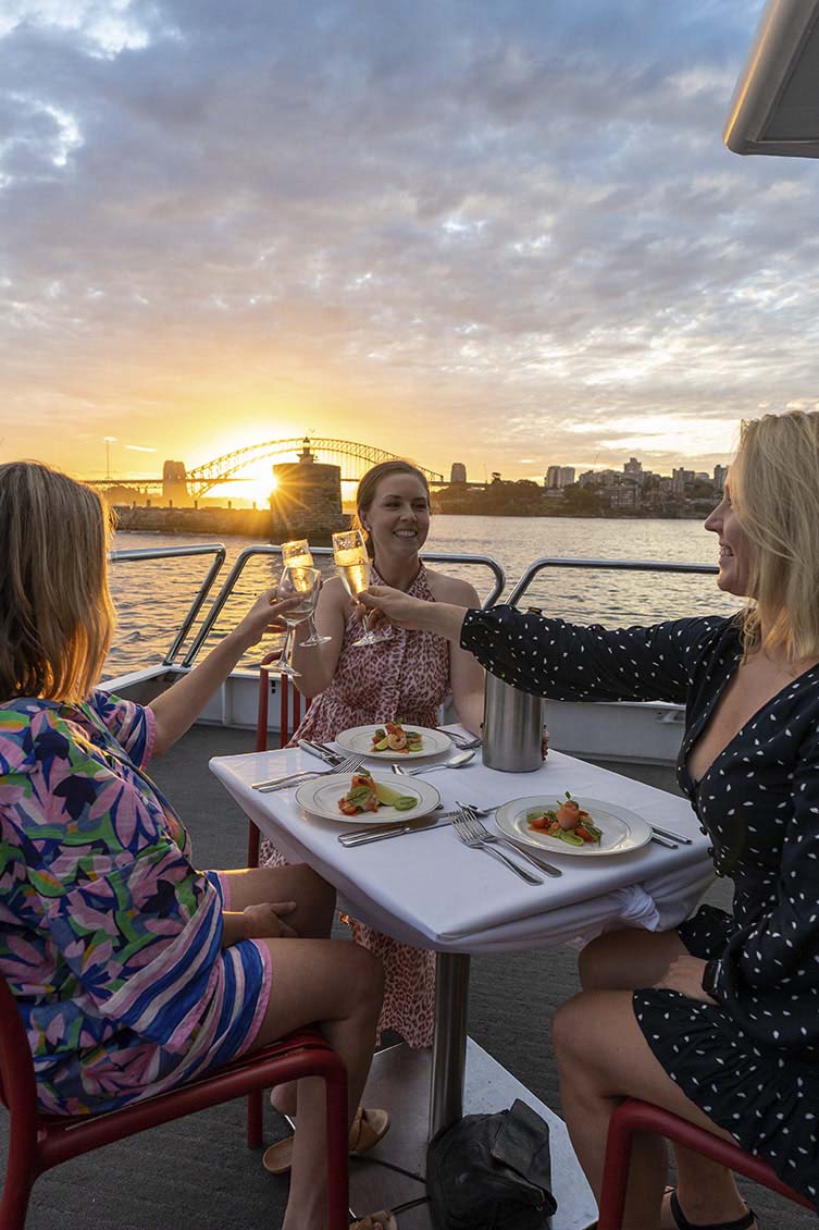 People dining on the outer deck of the ‘Magistic Two’ catamaran