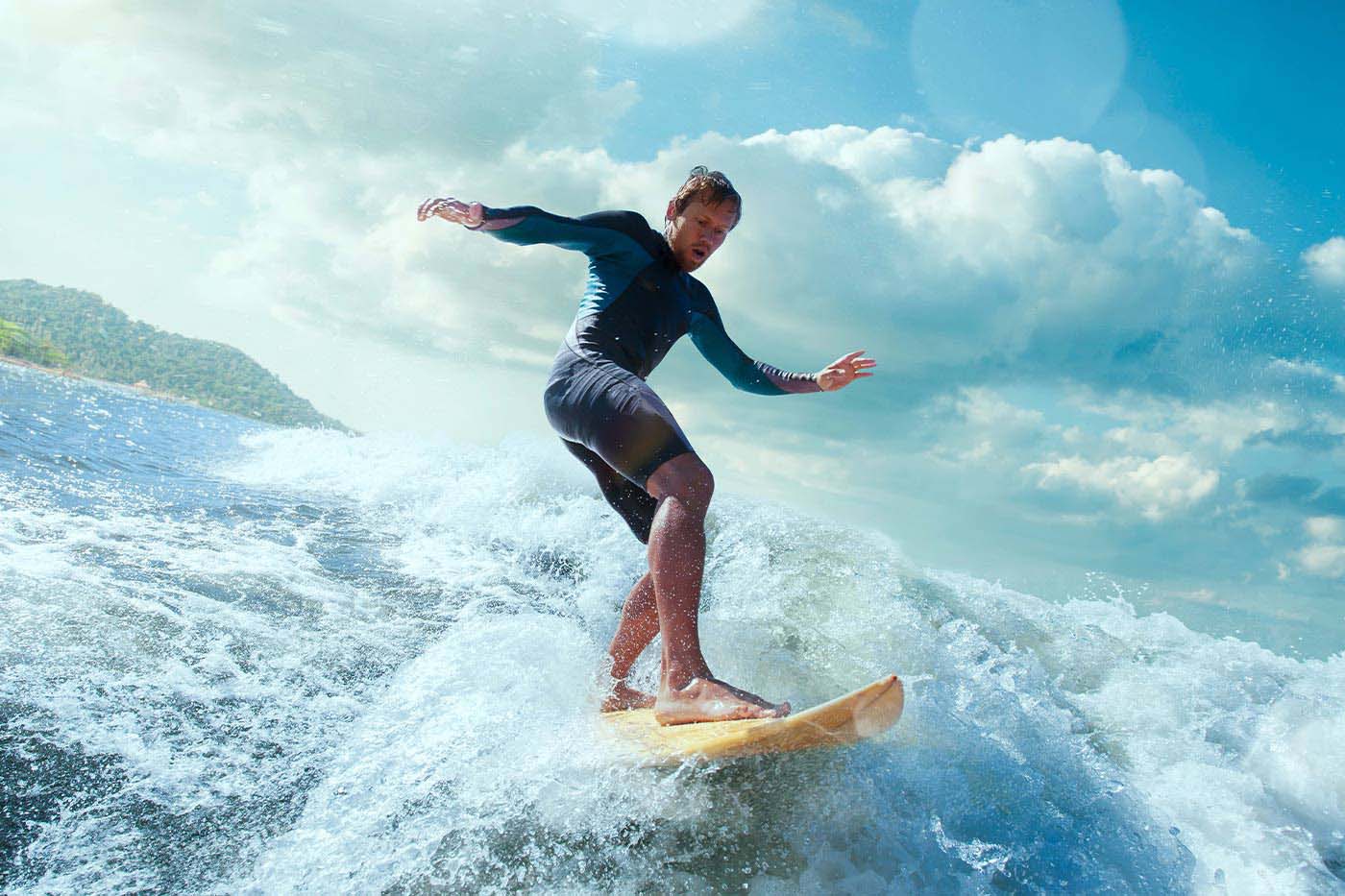 A man stylishly surfing on Sydney waters
