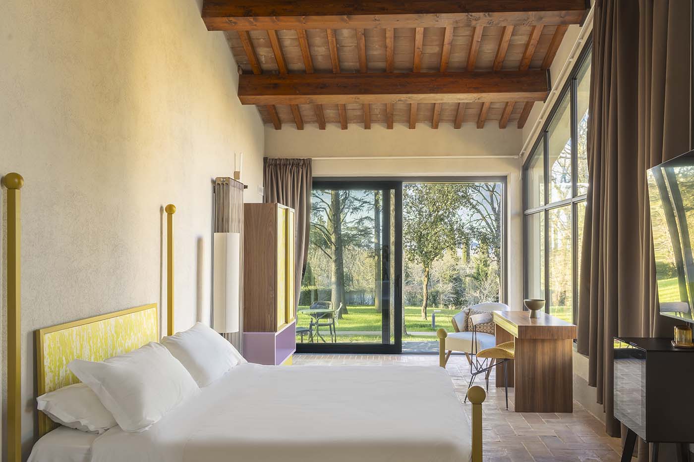 Raw plaster, olive groves and Umbrian hillside views define a new slow-living retreat above the medieval village of Monteleone d'Orvieto...