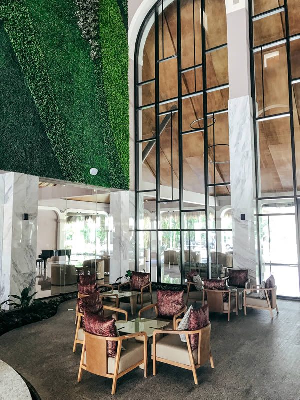 TRS Hotels Riviera Maya: The expansive marble of the TRS's lobby is offset by the lush green of two soaring living walls